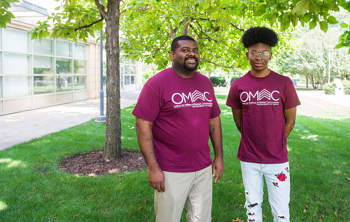 Terrell Odom, director of the Office for Military-Affiliated Communities, and Youth Internship Program intern Joshua Polk