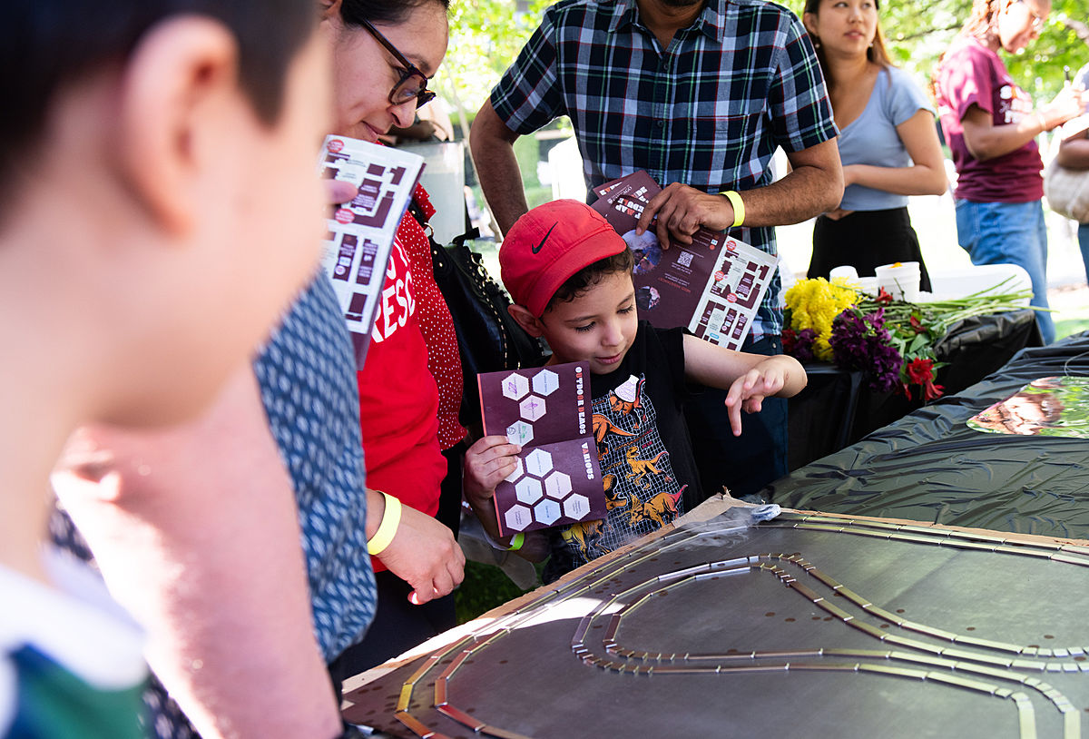 Children watch a scientific demonstration at the second annual South Side Science Festival.