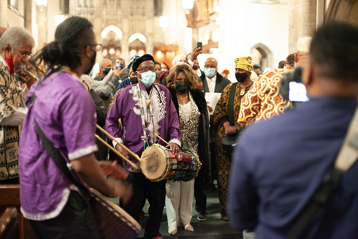 Zenobia Johnson-Black (center) walks out of Rockefeller Chapel after a three-hour service for her late husband, Timuel Black. The audience exited alongside a musical procession.